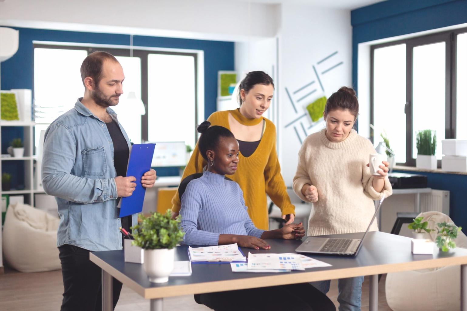 Team working on testing process improvements in modern office environment